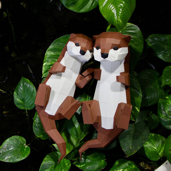 Paper trophy two little otters